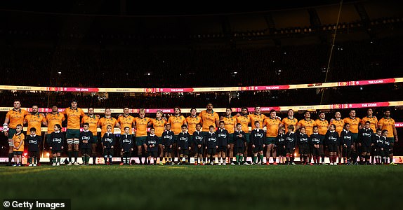 MELBOURNE, AUSTRALIA - JULY 26: Wallabies line up for the national anthem ahead of the second test of the series between Australia Wallabies and British & Irish Lions at the Melbourne Cricket Ground on July 26, 2025 in Melbourne, Australia. (Photo by Cameron Spencer/Getty Images)