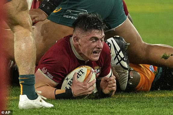 Dan Sheehan of the British & Irish Lions scores his side's opening try during the second rugby union test against Australia at the Melbourne Cricket Ground in Melbourne, Australia, Saturday, July 26, 2025. (AP Photo/Rick Rycroft)