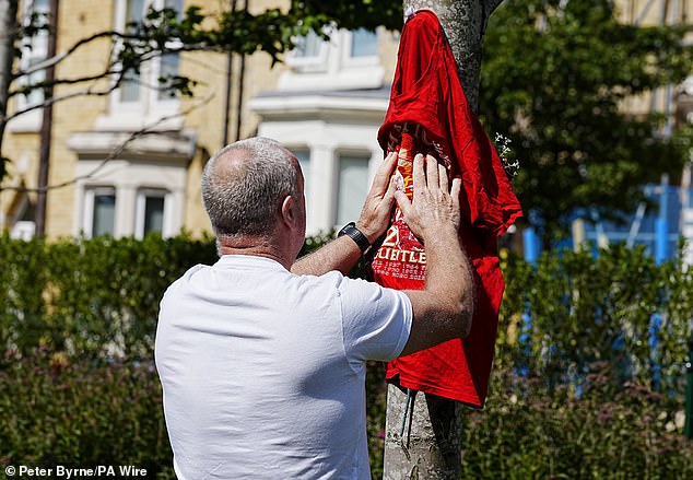 Shirts were also hung in tribute outside Liverpool's stadium
