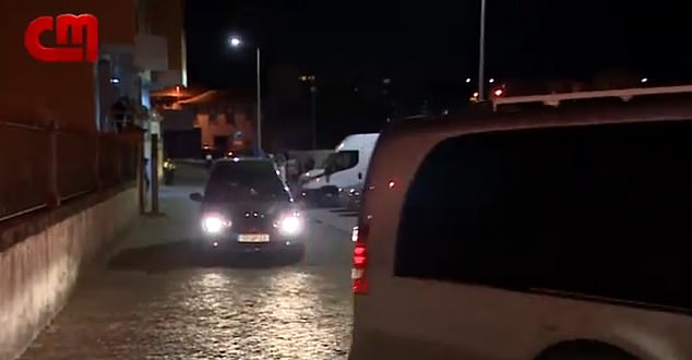 The two vehicles drove past the amassed crowd and were followed by applause