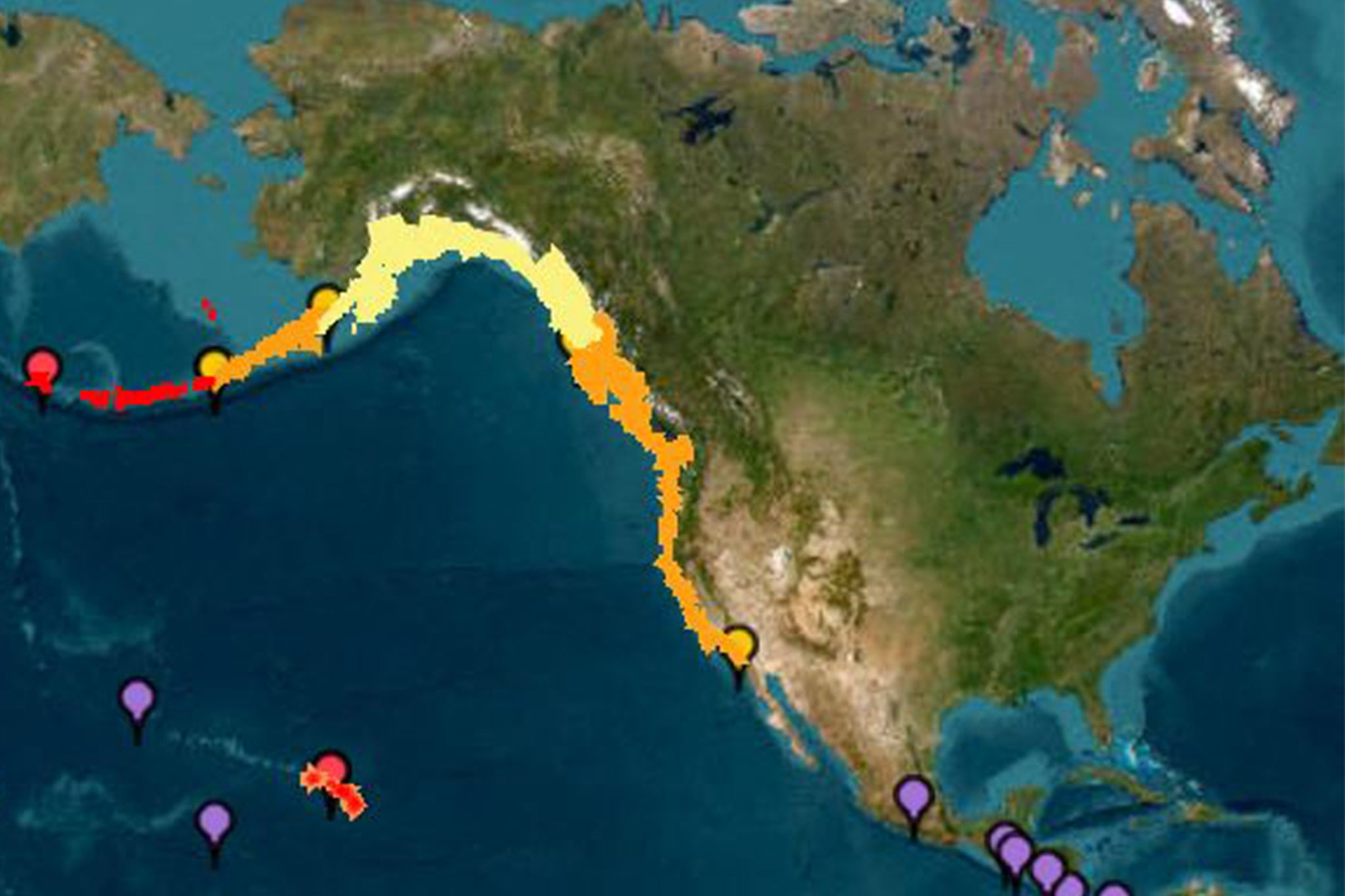 Ova slika ljubaznošću Nacionalne uprave za oceansku i atmosferu (NOAA) sustav upozorenja cunamija pokazuje početna upozorenja o tsunami (crvena), savjeti (narančasto) satove (žuta) i prijetnje (ljubičasta) nakon što je potres pogodio