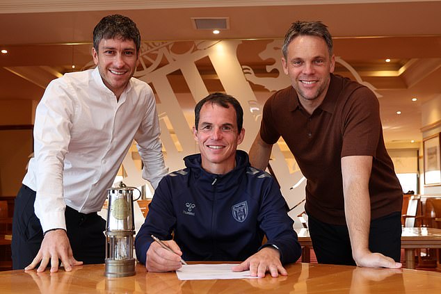 Le Bris, pictured with director of football Florent Ghisolfi (left) and sporting director Kristjaan Speakman (right) has signed a new three-year contract