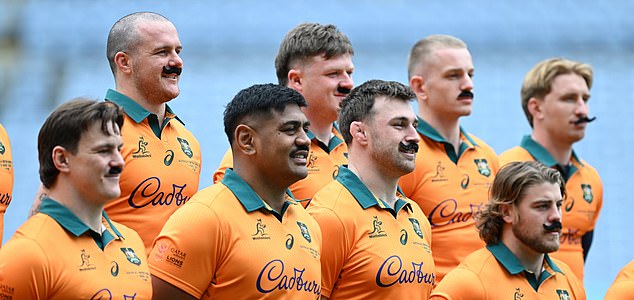 The entire Wallabies team including coach Joe Schmidt  wear stick on moustache's for retiring player Nic White  during an Australian Wallabies media opportunity at Accor Stadium, in Sydney, Friday, August 1, 2025. (AAP Image/Dean Lewins) NO ARCHIVING