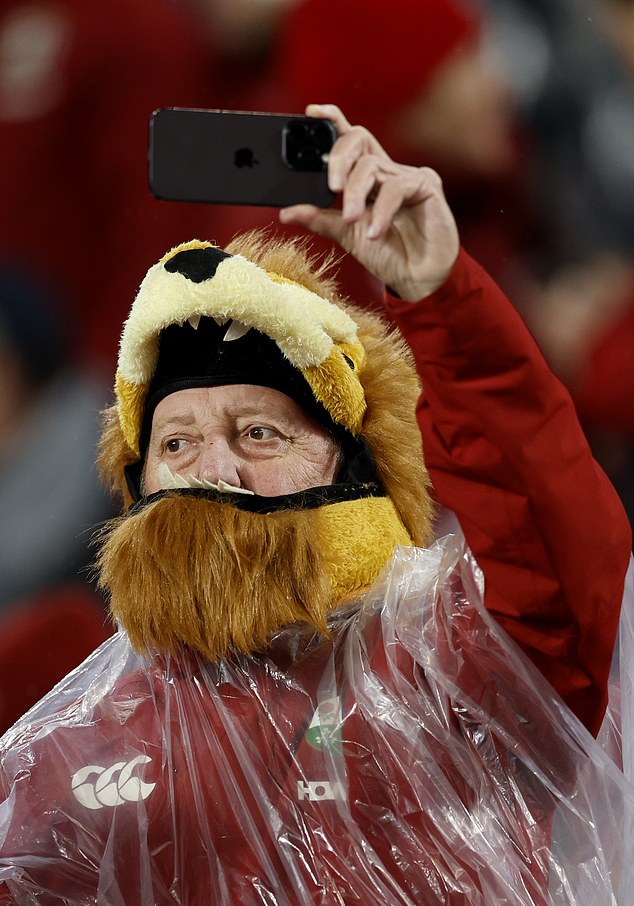 SYDNEY, AUSTRALIA - AUGUST 02: A British & Irish Lions fan takes a photo ahead of the third test of the series between Australia Wallabies and British & Irish Lions at Accor Stadium on August 02, 2025 in Sydney, Australia. (Photo by Darrian Traynor/Getty Images)