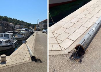 OPASNOST NA OTOKU ŽIRJU Srušen stup javne rasvjete pod visokim naponom prijeti otočanima i gostima, nadležni ne reagiraju!