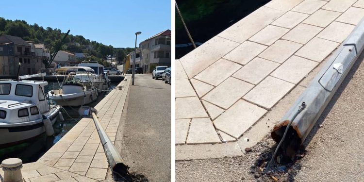 OPASNOST NA OTOKU ŽIRJU Srušen stup javne rasvjete pod visokim naponom prijeti otočanima i gostima, nadležni ne reagiraju!