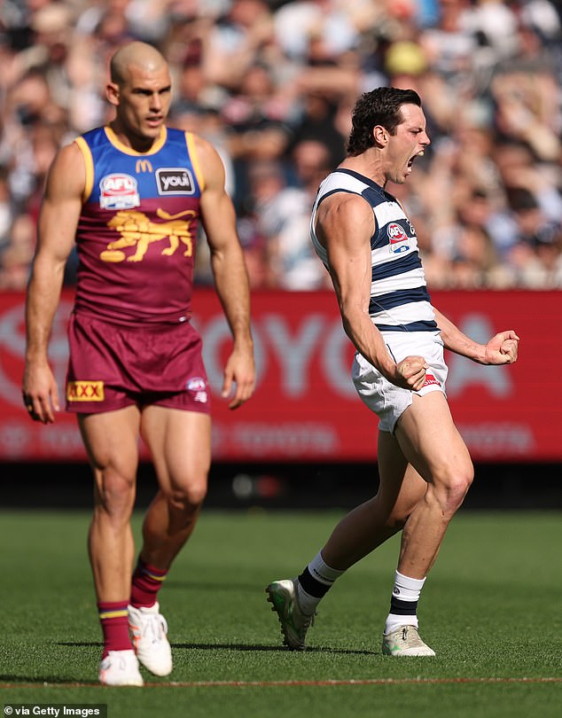 Shannon Neale roars after kicking possibly the best goal of the grand final - and his career