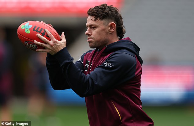 MELBOURNE, AUSTRALIA - SEPTEMBER 26: Lachie Neale of the Lions controls the ball during the Brisbane Lions AFL captain's run at Melbourne Cricket Ground on September 26, 2025 in Melbourne, Australia. (Photo by Robert Cianflone/Getty Images)
