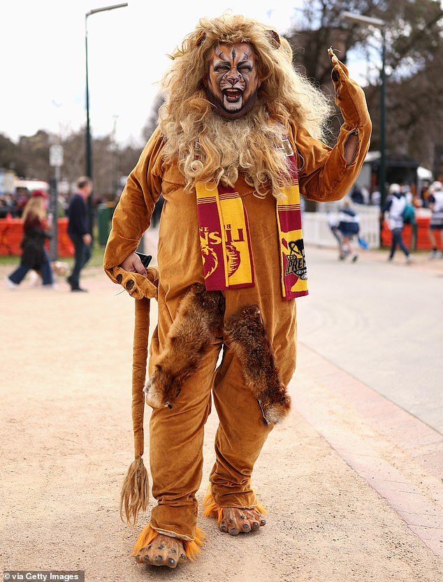 MELBOURNE, AUSTRALIA - SEPTEMBER 27: A Lions fan enjoys the atmosphere during the AFL Grand Final match between Geelong Cats and Brisbane Lions at Melbourne Cricket Ground on September 27, 2025 in Melbourne, Australia. (Photo by Cameron Spencer/AFL Photos/via Getty Images)