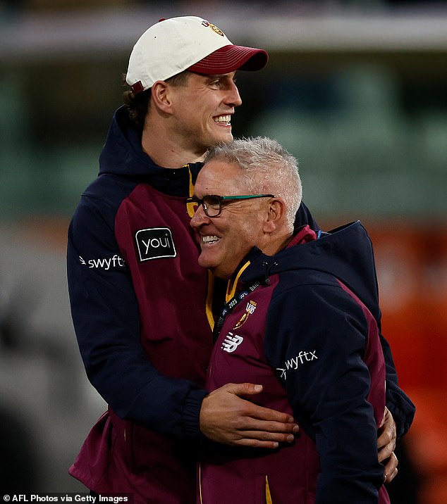 MELBOURNE, AUSTRALIA - SEPTEMBER 20: Jarrod Berry and Chris Fagan, Senior Coach of the Lions celebrate during the AFL First Preliminary Final match between the Collingwood Magpies and the Brisbane Lions at the Melbourne Cricket Ground on September 20, 2025 in Melbourne, Australia. (Photo by Michael Willson/AFL Photos via Getty Images)
