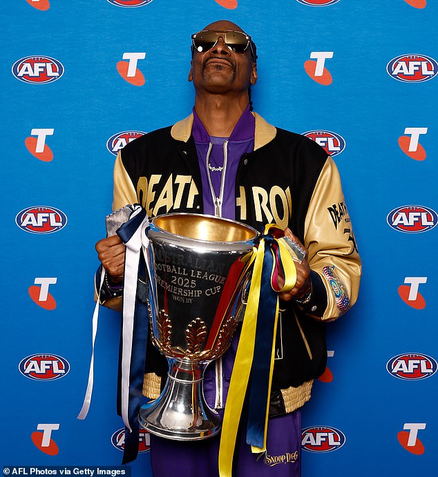 MELBOURNE, AUSTRALIA - SEPTEMBER 25: Snoop Dogg poses with the Premiership Cup during the 2025 Grand Final Entertainment Media Opportunity at the Melbourne Cricket Ground on September 25, 2025 in Melbourne, Australia. (Photo by Michael Willson/AFL Photos via Getty Images)