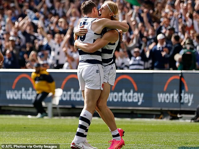 MELBOURNE, AUSTRALIA - SEPTEMBER 27: Patrick Dangerfield of the Cats (left) and Oliver Dempsey of the Cats celebrate after Dempsey kicked the first goal of the match during the AFL Grand Final match between the Geelong Cats and the Brisbane Lions at the Melbourne Cricket Ground on September 27, 2025 in Melbourne, Australia. (Photo by Michael Willson/AFL Photos via Getty Images)