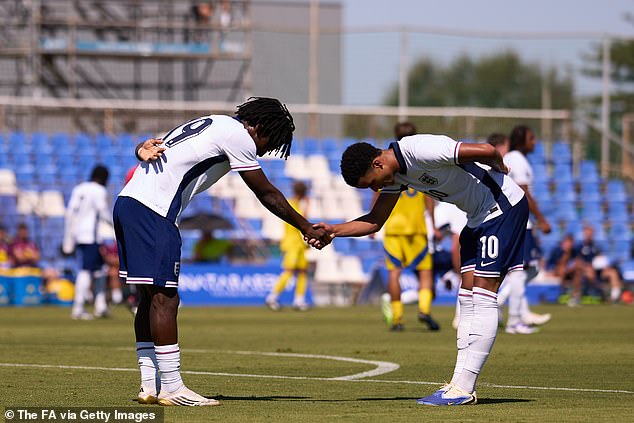 Mukasa (right) celebrates with fellow prospect Mheuka after the latter's goal against Ukraine for the Under 19s last month