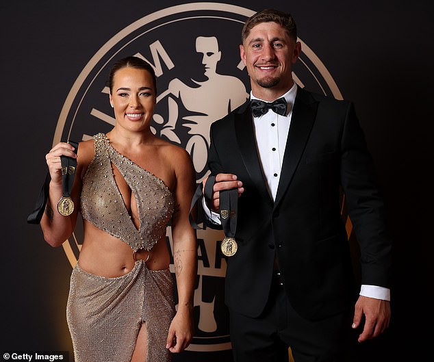 SYDNEY, AUSTRALIA - OCTOBER 01: Isabelle Kelly of the Sydney Roosters and Zac Lomax of the Parramatta Eels pose with the Provan-Summons Medal during the 2025 Dally M Awards at The Winx Stand, Royal Randwick Racecourse on October 01, 2025 in Sydney, Australia. (Photo by Mark Metcalfe/Getty Images)