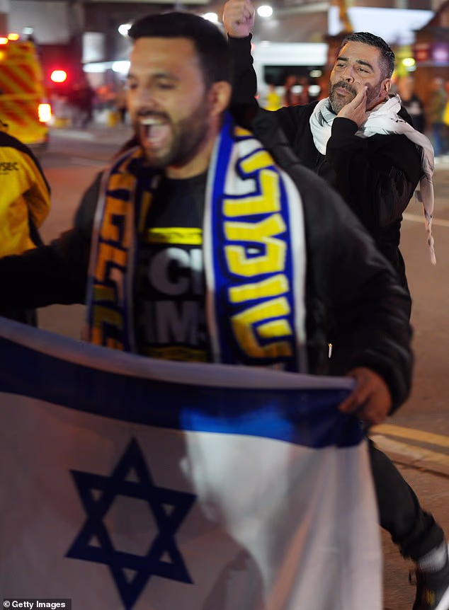 Israeli fans showing their support by waving flags on the streets. The two groups defied a police ring of steel