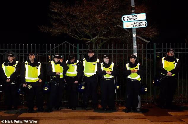 Banks of officers stand on duty on a day when police vehicles, dogs and drones descended on Birmingham