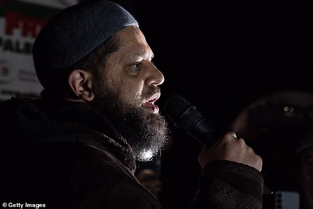 Imam Asrar Rashid addresses the protest against Maccabi Tel Aviv