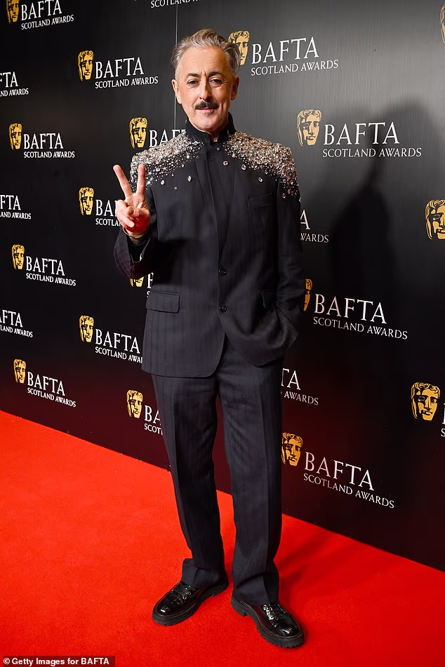 Alan Cumming nosio je jaknu jakne