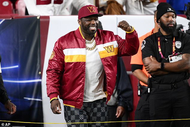 Recording artist 50 Cent gestures on the sidelines before the start of of an NFL football game, between the Washington Commanders and the Seattle Seahawks, Sunday, Nov. 2, 2025, in Landover, Md. (AP Photo/Nick Wass)