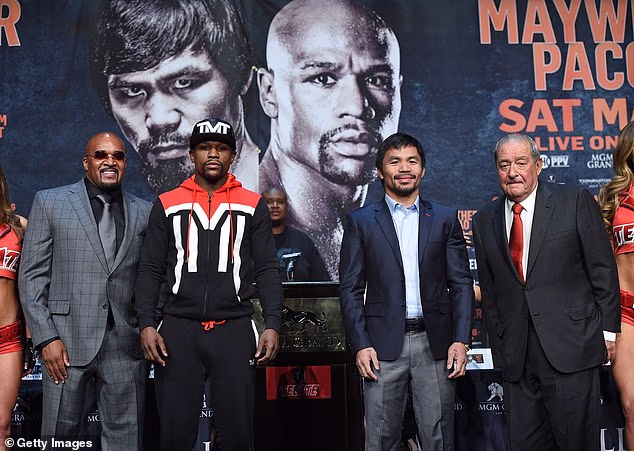 Mayweather pictured alongside rival Manny Pacquiao ahead of their fight in May 2015