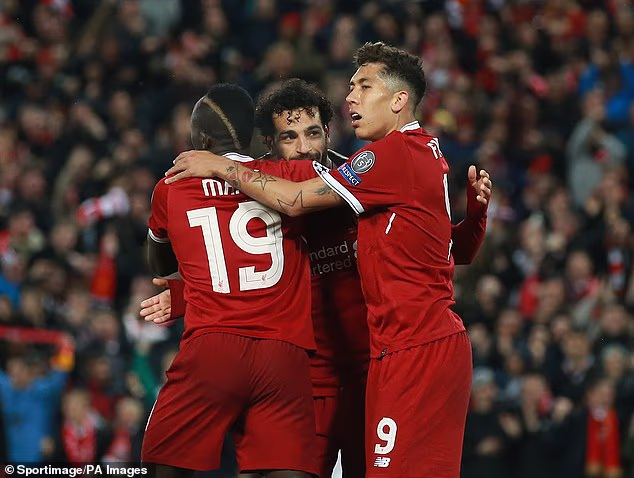 His unstoppable partnership with Sadio Mane (left) and Roberto Firmino (right) was the bedrock of the success of Klopp's Liverpool