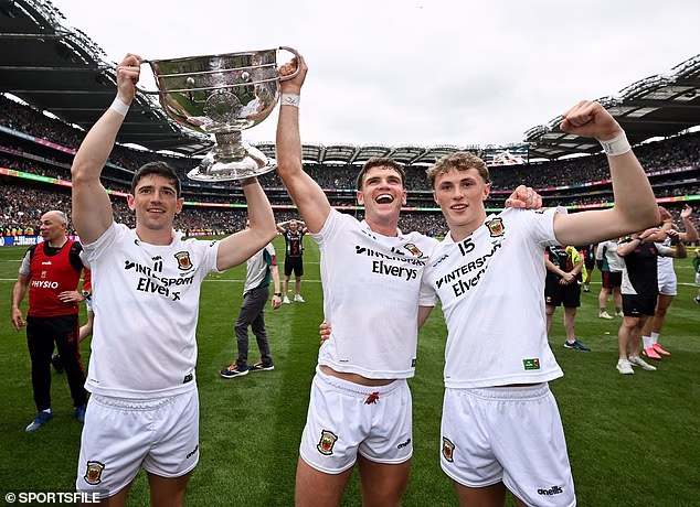 Kobe McDonald (right) celebrating Mayo's All-Ireland with with Conor Loftus and Jordan Flynn