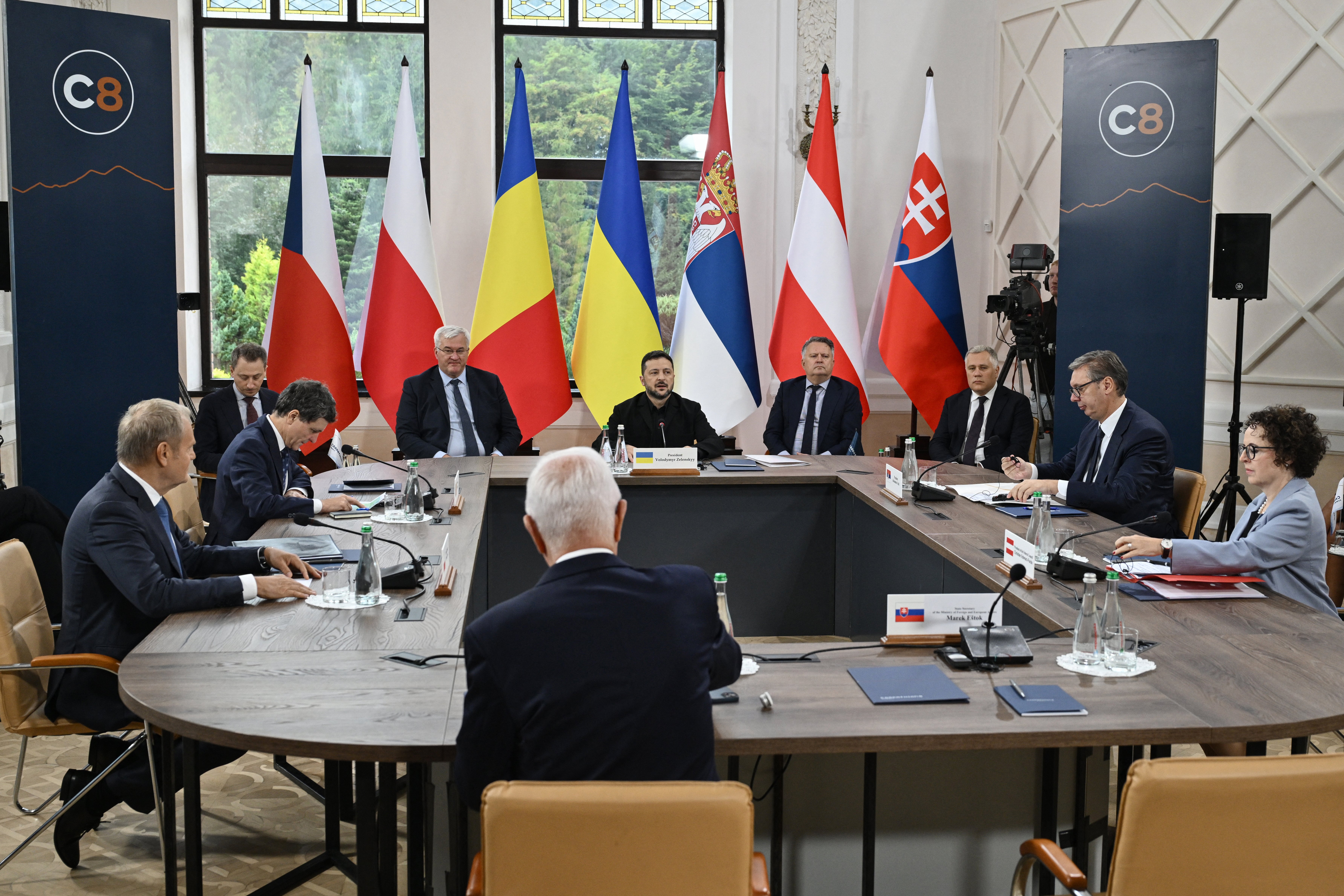 (From L on table) Poland's Prime Minister Donald Tusk, Romania's President Nicusor Dan, Ukraine's President Volodymyr Zelensky, Serbia's President Aleksandar Vucic and President of the Federal Council of Austria Christine Schwarz-Fuchs attend the Carpathian 8 summit on Sept 18 amid the Russian invasion of Ukraine