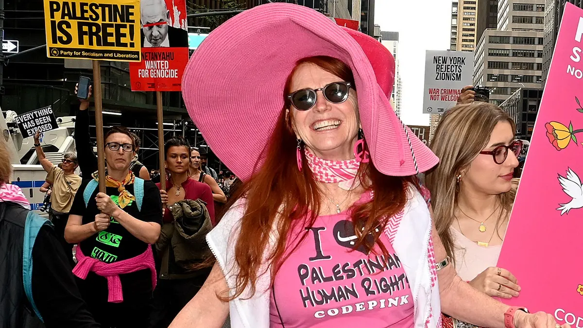 Jodie Evans pictured in pink in a protest