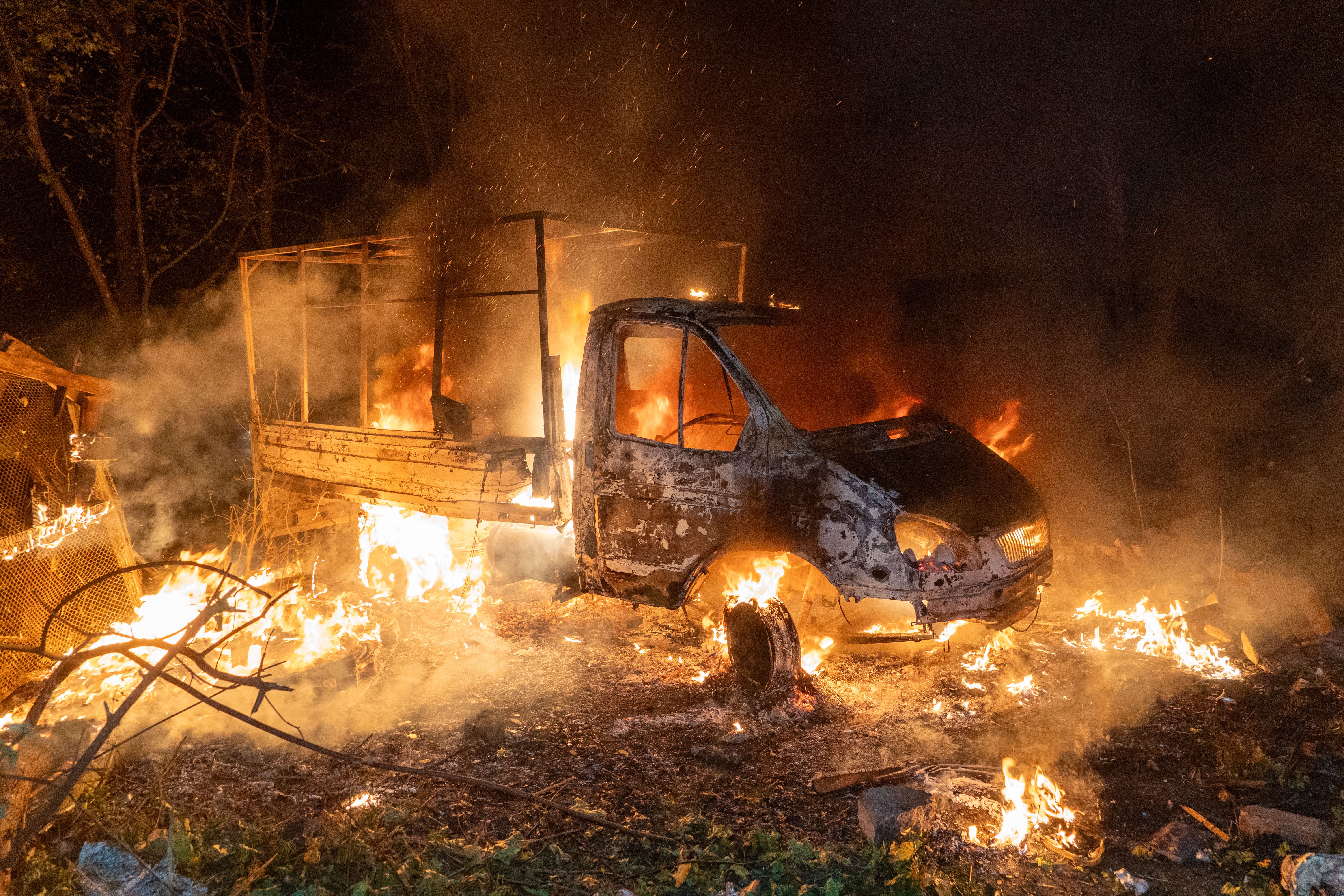 A car burns after a Russian drone strike on a residential neighborhood in Kharkiv, Ukraine