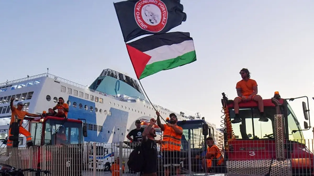 Dockworkers block a ship during a pro-Palestinian protest at the port of Livorno.